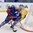 MINSK, BELARUS - MAY 15: France's Baptiste Amar #27 stickhandles the puck behind the net with Sweden's Dennis Rasmussen #40 chasing during preliminary round action at the 2014 IIHF Ice Hockey World Championship. (Photo by Richard Wolowicz/HHOF-IIHF Images)

